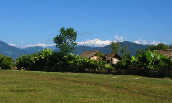 A village with snow mountain in the background